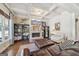 Comfortable living room featuring a stone fireplace, built-in shelves, and coffered ceiling at 3149 Hidden Falls Ne Dr, Buford, GA 30519