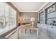 Bright office with large window, built-in shelves and cabinets, and designer paint colors at 3149 Hidden Falls Ne Dr, Buford, GA 30519