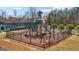Community playground with slides, climbers, and a secure fenced area for enjoyment at 3149 Hidden Falls Ne Dr, Buford, GA 30519