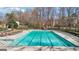 Community pool with many lounge chairs for relaxing on a nice day near shade trees at 3149 Hidden Falls Ne Dr, Buford, GA 30519