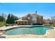 Expansive backyard pool with attached spa, offering a luxurious outdoor oasis with a brick home backdrop at 3149 Hidden Falls Ne Dr, Buford, GA 30519