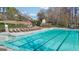 The inviting pool has many chairs for relaxing with a brick wall surround the pool at 3149 Hidden Falls Ne Dr, Buford, GA 30519