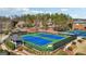 The green and blue tennis courts are ready for community players with players playing now at 3149 Hidden Falls Ne Dr, Buford, GA 30519