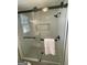 Glass enclosed shower with black hardware and a tiled backsplash at 103 Greenwood Dr, Stockbridge, GA 30281