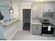 Open kitchen with granite countertops, stainless steel appliances, and access to the dining area at 103 Greenwood Dr, Stockbridge, GA 30281