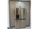 Stainless steel refrigerator surrounded by gray cabinets at 103 Greenwood Dr, Stockbridge, GA 30281