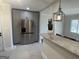 Kitchen with stainless steel refrigerator, granite counter tops and view into separate dining room at 103 Greenwood Dr, Stockbridge, GA 30281