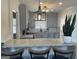 Updated kitchen featuring stainless steel appliances, granite counters, and modern gray cabinets at 103 Greenwood Dr, Stockbridge, GA 30281