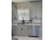 Kitchen showcasing gray cabinets, granite countertops, stainless steel appliances, and a modern faucet at 103 Greenwood Dr, Stockbridge, GA 30281