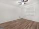 Bedroom featuring a ceiling fan, window and wood floors at 117 Spring St, Stockbridge, GA 30281