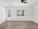 Living room with hardwood floors, window and door with window pane at 117 Spring St, Stockbridge, GA 30281