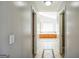 Bathroom hall leads to soaking tub beneath window at 132 Westmont Way, Tyrone, GA 30290