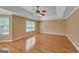 Bright bedroom with tray ceiling, ceiling fan and large windows at 132 Westmont Way, Tyrone, GA 30290