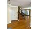 Warm and inviting foyer with hardwood flooring and stairway to the second floor, exuding simple elegance at 132 Westmont Way, Tyrone, GA 30290