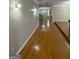 Long hallway with gleaming hardwood floors leads to the rest of the home at 132 Westmont Way, Tyrone, GA 30290