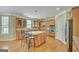 Gourmet kitchen with granite countertops, stainless steel appliances, and large center island at 132 Westmont Way, Tyrone, GA 30290
