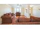Cozy living room featuring comfortable seating, a bay window, and hardwood floors at 132 Westmont Way, Tyrone, GA 30290