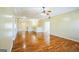 Spacious living room with sleek hardwood flooring, providing ample space for entertaining and relaxation at 132 Westmont Way, Tyrone, GA 30290