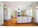 Comfortable living room featuring built-in shelving, a fireplace, and hardwood floors at 132 Westmont Way, Tyrone, GA 30290