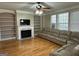 Inviting living room with built-in bookshelves, fireplace, and plenty of natural light at 132 Westmont Way, Tyrone, GA 30290