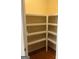 Pantry with wooden floor and shelving at 132 Westmont Way, Tyrone, GA 30290