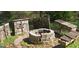 Backyard fire pit with adjacent benches and decorative wooden panels is perfect for outdoor gatherings at 1901 E Farris Ave, East Point, GA 30344