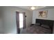 Cozy bedroom with ceiling fan, tray ceiling, neutral paint, gray bedding, and decorative art at 1901 E Farris Ave, East Point, GA 30344