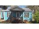 Inviting home showcasing a cozy, covered front porch with a ceiling fan at 1901 E Farris Ave, East Point, GA 30344
