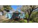 Charming cottage-style home featuring a covered porch and blooming tree at 1901 E Farris Ave, East Point, GA 30344