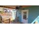 Quaint covered front porch with a ceiling fan and classic exterior door at 1901 E Farris Ave, East Point, GA 30344