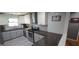 Bright kitchen with stainless steel appliances, white upper cabinets, and light gray lower cabinets at 1901 E Farris Ave, East Point, GA 30344