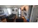 Spacious living room with hardwood floors, stone fireplace, and comfortable seating at 1901 E Farris Ave, East Point, GA 30344