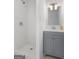 Bathroom featuring a tiled shower and vanity with modern lighting at 2377 Beecher Sw Rd, Atlanta, GA 30311
