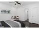Inviting bedroom featuring hardwood floors, ceiling fan, neutral paint, and comfortable seating at 2377 Beecher Sw Rd, Atlanta, GA 30311