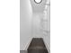 Walk-in closet with custom shelving and dark hardwood flooring at 2377 Beecher Sw Rd, Atlanta, GA 30311