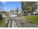Exterior shot of the home showing the side view, driveway and manicured lawn at 2377 Beecher Sw Rd, Atlanta, GA 30311