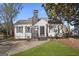 Charming home featuring a stone chimney, black shutters, and a well-manicured lawn at 2377 Beecher Sw Rd, Atlanta, GA 30311