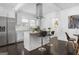 Bright, renovated kitchen featuring stainless steel appliances, quartz countertops and a center island at 2377 Beecher Sw Rd, Atlanta, GA 30311
