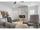 Cozy living room featuring a modern fireplace, stylish decor, and comfortable seating at 2377 Beecher Sw Rd, Atlanta, GA 30311