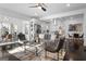Open-concept living room with contemporary furniture and dark hardwood floors that flow into kitchen at 2377 Beecher Sw Rd, Atlanta, GA 30311