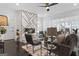 Bright living room with a decorative fireplace, sleek furniture, and hardwood floors at 2377 Beecher Sw Rd, Atlanta, GA 30311