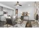 Living room with modern decor, fireplace, and spiral staircase at 2377 Beecher Sw Rd, Atlanta, GA 30311
