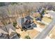 Aerial view of a two-story brick home situated on a corner lot with a two-car garage and driveway at 3967 Bellingrath Main Nw, Kennesaw, GA 30144
