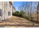 Backyard with gentle slope, wooded backdrop, and partial fencing for a private outdoor space at 3967 Bellingrath Main Nw, Kennesaw, GA 30144