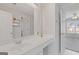 Bright bathroom with a white vanity, large mirror, and views of a secondary room at 3967 Bellingrath Main Nw, Kennesaw, GA 30144