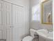 Cozy half-bathroom with a modern white sink and fixtures, enhanced by natural light from the window at 3967 Bellingrath Main Nw, Kennesaw, GA 30144