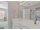 Bright bathroom with a white vanity, large mirror, and views of a secondary room at 3967 Bellingrath Main Nw, Kennesaw, GA 30144