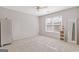 Neutral bedroom with a window offering natural light and neutral colored carpet at 3967 Bellingrath Main Nw, Kennesaw, GA 30144
