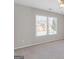 Cozy bedroom with neutral carpet, a window with blinds, and light gray walls, ideal for relaxation at 3967 Bellingrath Main Nw, Kennesaw, GA 30144