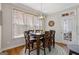 Cozy dining area with hardwood floors, ample natural light, and a view of the outdoors at 3967 Bellingrath Main Nw, Kennesaw, GA 30144